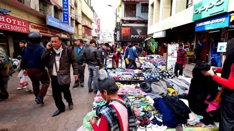Local shoppers exploring Shillong preloved fashion stalls at Police Bazar.